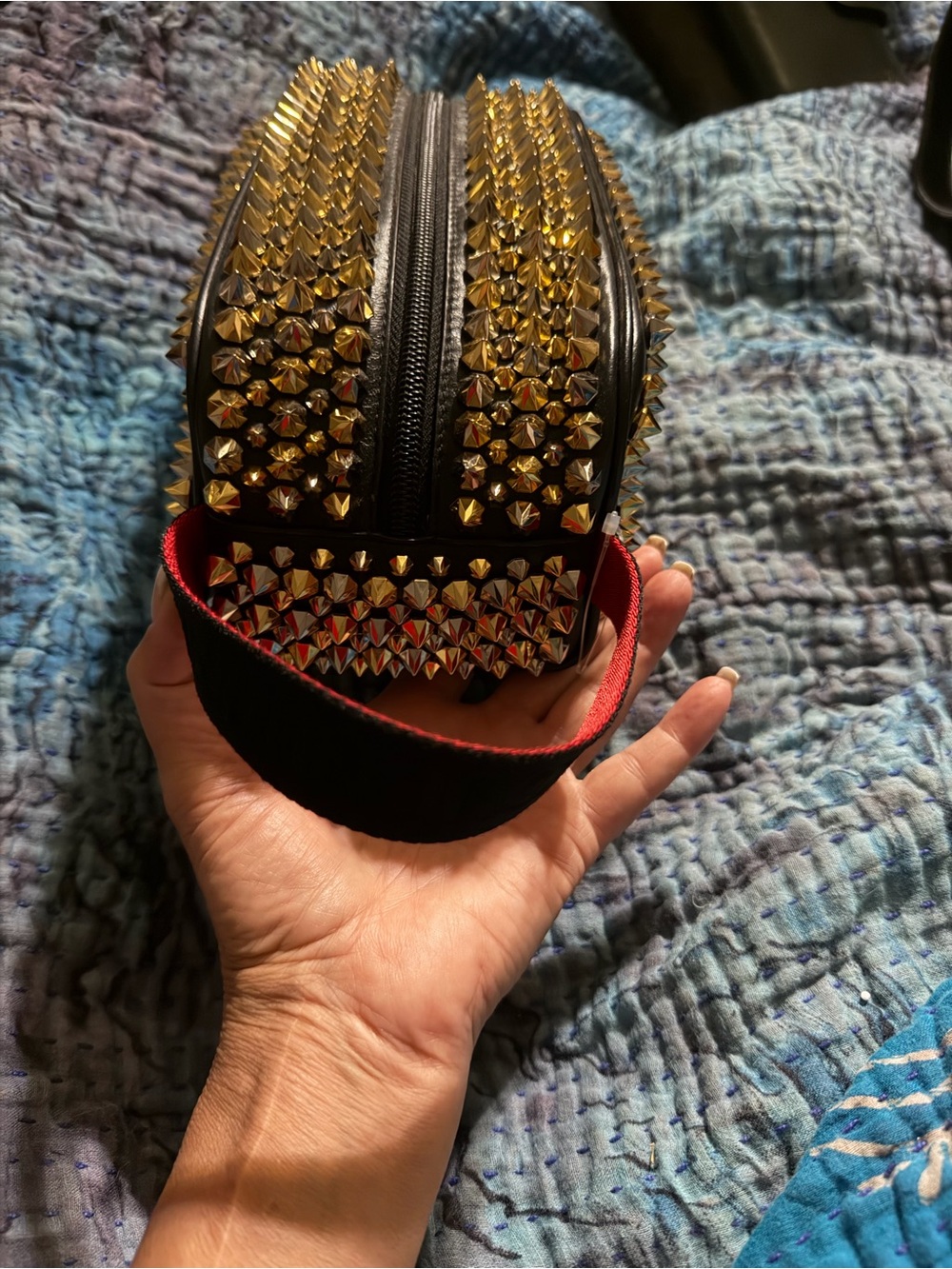 Christian Louboutin Black Wristlet with Gold Spikes and Red-Trim Handle